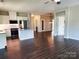 Open-concept space with hardwood floors and views of the modern kitchen at 195 Willow Valley Dr, Mooresville, NC 28115