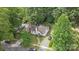 Charming home featuring lush trees, and a well-manicured lawn at 2130 Chesterfield Ave, Charlotte, NC 28205