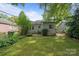 Charming backyard with a lush lawn and mature trees at 2130 Chesterfield Ave, Charlotte, NC 28205