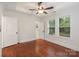 Bedroom with hardwood floors, closet, and tray ceilings at 2130 Chesterfield Ave, Charlotte, NC 28205