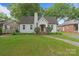 A well-maintained home with a brick chimney, manicured lawn, and charming curb appeal at 2130 Chesterfield Ave, Charlotte, NC 28205