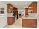 Updated kitchen with granite countertops, stainless appliances, and tiled floors at 2130 Chesterfield Ave, Charlotte, NC 28205