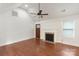 Bright living room features vaulted ceiling, ceiling fan, hardwood floors, and fireplace at 2130 Chesterfield Ave, Charlotte, NC 28205