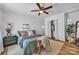 Comfortable bedroom with a ceiling fan, plush bedding, and natural light at 2222 19Th Ne Ave, Hickory, NC 28601