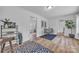 Open-concept dining area with wood flooring, white walls, and modern furnishings at 2222 19Th Ne Ave, Hickory, NC 28601
