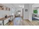 Inviting hallway with wood-look floors, a stylish console table, and decor that complements the space's bright ambiance at 2222 19Th Ne Ave, Hickory, NC 28601