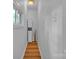 Hallway with a wood floor and a built in storage cabinet at 2222 19Th Ne Ave, Hickory, NC 28601