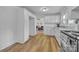 Open kitchen with views into the living room, featuring stainless steel appliances and neutral tones at 2222 19Th Ne Ave, Hickory, NC 28601