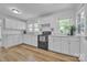 Bright kitchen with white cabinets, marble countertops, and modern appliances at 2222 19Th Ne Ave, Hickory, NC 28601