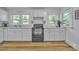 Well-lit kitchen features white cabinetry, modern appliances, and marble countertops at 2222 19Th Ne Ave, Hickory, NC 28601