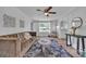 Bright living room boasts a ceiling fan, natural light, comfortable sofa, and stylish decor at 2222 19Th Ne Ave, Hickory, NC 28601