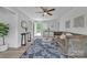 Comfortable living room featuring neutral walls, a floral rug, and access to an inviting outdoor deck space at 2222 19Th Ne Ave, Hickory, NC 28601