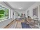 Bright and airy living room featuring a large window, dining table, and contemporary decor at 2222 19Th Ne Ave, Hickory, NC 28601