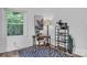 Well-lit home office with dark desk, stylish decor, and large windows offers a serene workspace at 2222 19Th Ne Ave, Hickory, NC 28601