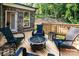 Inviting back deck featuring a fire pit and comfortable seating, perfect for outdoor relaxation and entertaining at 240 Mark Ryan Ln, Dallas, NC 28034
