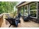 Inviting outdoor seating area on the back porch with a fire pit at 240 Mark Ryan Ln, Dallas, NC 28034
