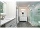 Bathroom features double vanity, stylish mirrors and modern tiled shower at 240 Mark Ryan Ln, Dallas, NC 28034