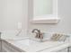 Bathroom vanity with quartz countertops, modern faucet and white cabinetry at 240 Mark Ryan Ln, Dallas, NC 28034