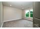 Well lit bedroom with neutral walls, carpet and a double window at 240 Mark Ryan Ln, Dallas, NC 28034