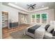 Bright bedroom with large windows, tray ceiling, hardwood floors, and ample space at 240 Mark Ryan Ln, Dallas, NC 28034