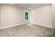 A carpeted bedroom features recessed lighting, fresh paint and a window with natural light at 240 Mark Ryan Ln, Dallas, NC 28034