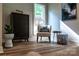 Sitting area features stylish wood cabinet, chair and artistic wall decor at 240 Mark Ryan Ln, Dallas, NC 28034