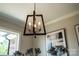 Chic, modern chandelier in the dining room complements the sophisticated decor and lighting at 240 Mark Ryan Ln, Dallas, NC 28034
