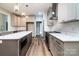 Modern kitchen with stainless steel appliances, subway tile backsplash, and center island with countertop at 240 Mark Ryan Ln, Dallas, NC 28034