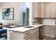 Stylish kitchen with stainless steel appliances, granite countertops, and a view into the dining area at 240 Mark Ryan Ln, Dallas, NC 28034
