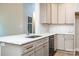Modern kitchen featuring stainless steel appliances, white countertops, and gray cabinets at 240 Mark Ryan Ln, Dallas, NC 28034