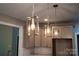 Pendant lights over granite counter tops and stainless steel appliances make this kitchen modern at 240 Mark Ryan Ln, Dallas, NC 28034