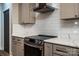 Updated kitchen featuring marble countertops, subway tile backsplash, and stainless steel appliances at 240 Mark Ryan Ln, Dallas, NC 28034