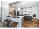 Modern kitchen featuring an island with countertop seating, sleek cabinets, and stainless steel appliances at 240 Mark Ryan Ln, Dallas, NC 28034