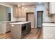 Well-lit kitchen with stainless steel appliances, ample cabinet space, and a center island with a cooktop at 240 Mark Ryan Ln, Dallas, NC 28034