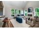 Inviting living room with a fireplace, large windows, and comfortable seating at 240 Mark Ryan Ln, Dallas, NC 28034