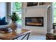 Living room showcasing a fireplace, modern decor, and abundant natural light at 240 Mark Ryan Ln, Dallas, NC 28034