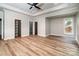 Spacious main bedroom featuring a tray ceiling, walk-in closet and luxury vinyl plank flooring at 240 Mark Ryan Ln, Dallas, NC 28034