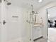Bright bathroom with glass enclosed shower, white vanity and decorative mirror at 2636 Chilton Pl, Charlotte, NC 28207