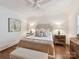 Cozy bedroom featuring a comfortable bed, stylish lighting, and a soft color palette at 2636 Chilton Pl, Charlotte, NC 28207
