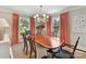 Elegant dining room features a large wood table, upholstered chairs, and natural lighting at 2636 Chilton Pl, Charlotte, NC 28207