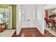 Bright foyer showcasing hardwood floors and a glimpse into the formal dining and living room at 2636 Chilton Pl, Charlotte, NC 28207