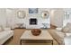 Cozy living room featuring a fireplace, decorative mirrors, and neutral furnishings at 2636 Chilton Pl, Charlotte, NC 28207