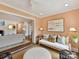 Bright sunroom featuring neutral decor, a ceiling fan and an open doorway offering seamless flow to other areas of the home at 2636 Chilton Pl, Charlotte, NC 28207