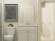 Bright bathroom with a white vanity and open doorway at 2837 Morning Song Way, Lancaster, SC 29720
