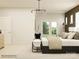 Open bedroom with a chair and large windows providing natural light at 2837 Morning Song Way, Lancaster, SC 29720