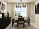 Elegant dining room with large window, stylish lighting, and modern decor at 2837 Morning Song Way, Lancaster, SC 29720