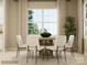 Modern dining area with round table, chairs, and large window, great for entertaining at 2837 Morning Song Way, Lancaster, SC 29720