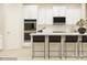 Modern kitchen with stainless steel appliances and sleek breakfast bar at 2837 Morning Song Way, Lancaster, SC 29720