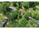 Aerial view showcases a home with mature trees and an expansive lawn in a neighborhood setting at 308 Home Rd, Salisbury, NC 28147