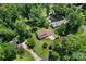Beautiful aerial view of property with mature trees, long driveway, and a two-car garage at 308 Home Rd, Salisbury, NC 28147